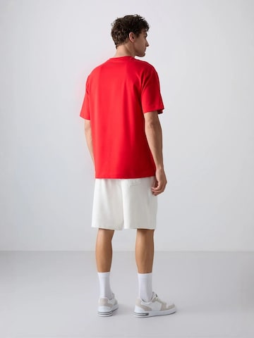 Maglietta di Tommy Life in rosso