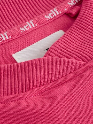Sweat-shirt self. en rose