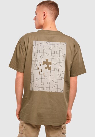 Merchcode T-Shirt 'Missing Peace' in Grün