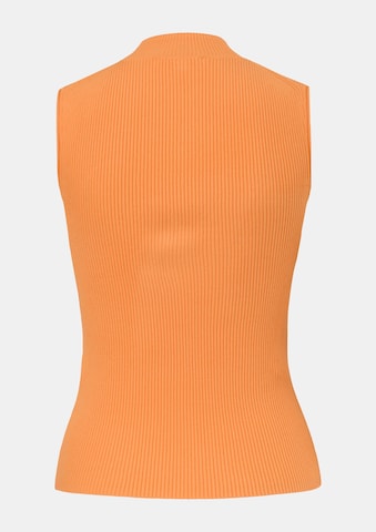 Top in maglia di COMMA in arancione: dietro