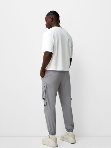 Bershka Zúžený Kapsáče – šedá