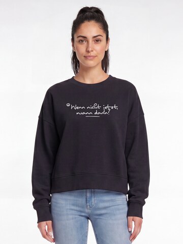 Watapparel Sweatshirt 'Wenn Nicht Jetzt Wann Dann' in Zwart: voorkant