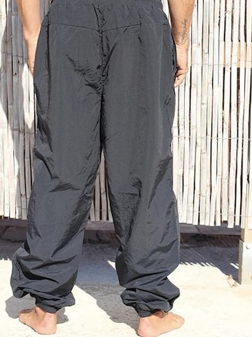 Surf Monkey - Loosefit Pantalón funcional en negro