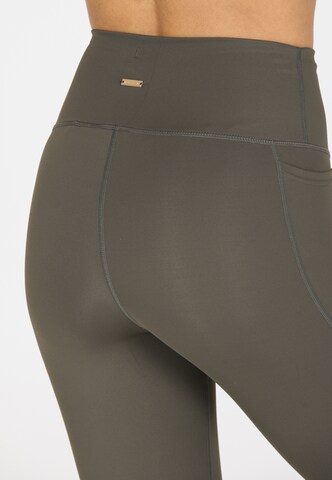 Athlecia Skinny Sportbroek 'Aliya' in Bruin
