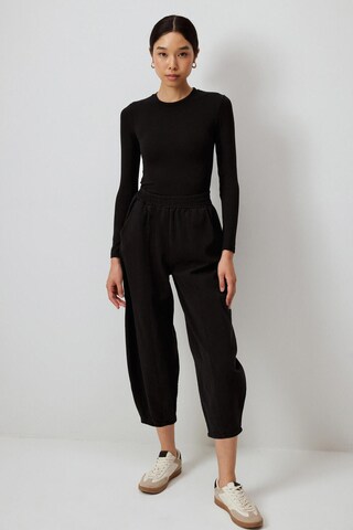 Touche Prive Baggy Broek in Zwart: voorkant