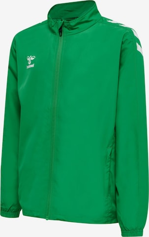 Veste de sport 'hmlCORE XK MICRO ZIP JACKET KIDS' Hummel en vert : devant