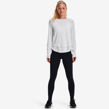 UNDER ARMOUR Skinny Urheiluhousut 'Motion' värissä musta