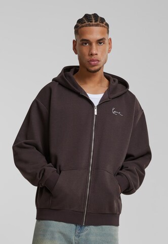 Veste de survêtement Karl Kani en marron : devant