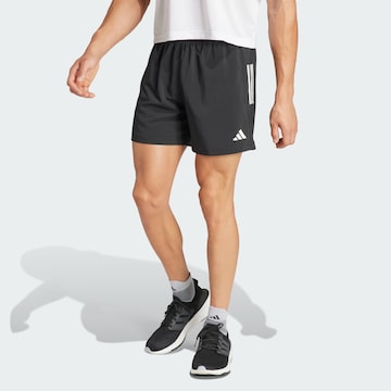 ADIDAS PERFORMANCE - Regular Calças de desporto 'Own The Run' em preto: frente