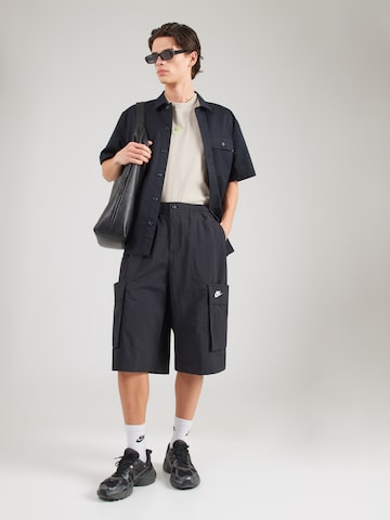 Nike Sportswear Loosefit Cargobyxa 'CLUB' i svart