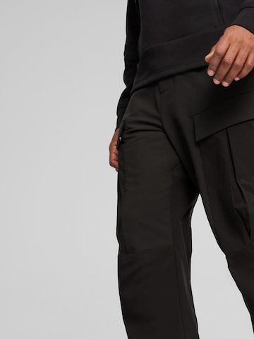 PUMA Обычный Спортивные штаны 'SEASONS' в Черный: спереди