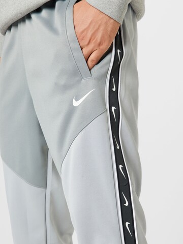 Nike Sportswear Tapered Pants in Grey