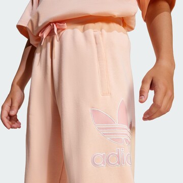ADIDAS ORIGINALSTapered Hlače - roza boja