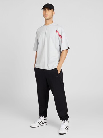 ALPHA INDUSTRIES Tapered Pants 'Essentials' in Black