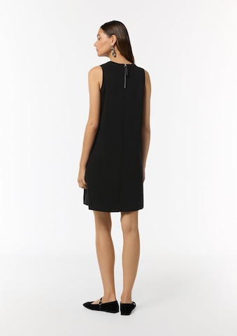 Abito di comma casual identity in nero: dietro