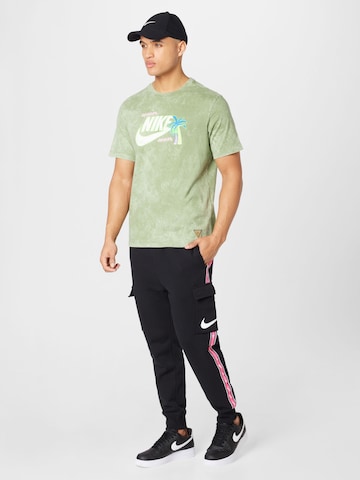 Tapered Pantaloni cu buzunare de la Nike Sportswear pe negru