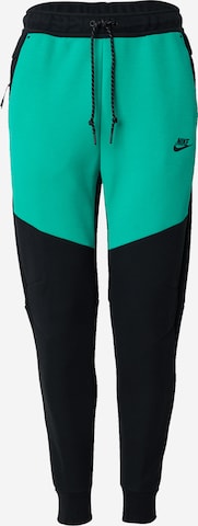 Pantalon 'TCH FLC' Nike Sportswear en noir : devant