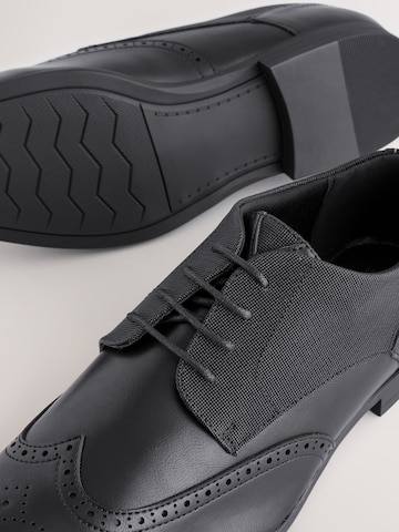 Next Čevlji na vezalke | črna barva