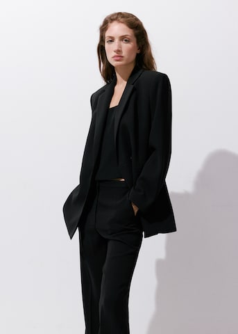 MANGO Boot cut Trousers with creases 'IGUANA' in Black