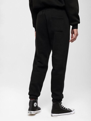 Antioch Tapered Trousers in Black