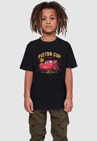 ABSOLUTE CULT Shirt 'Cars - Piston Cup Champion' in Zwart: voorkant