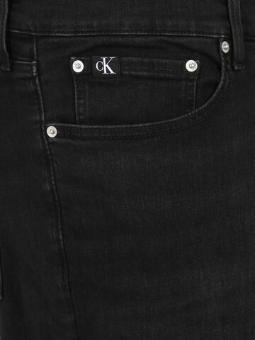 Calvin Klein Jeans Plus ضيق جينز بلون أسود