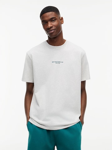 T-Shirt Tommy Jeans en blanc : devant
