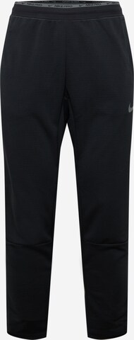 Pantaloni sport de la NIKE pe negru: față