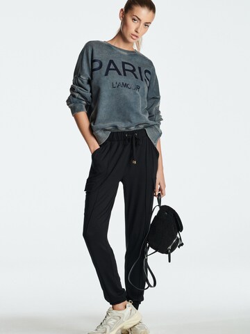 Tapered Pantaloni cargo di Next in nero