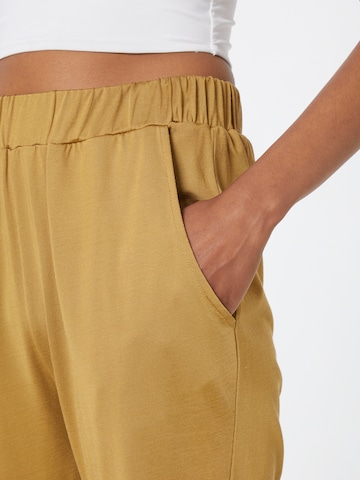 Effilé Pantalon 'Glowy' Karo Kauer en jaune