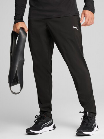 PUMA - Tapered Pantalón deportivo 'TAD Essentials' en negro: frente