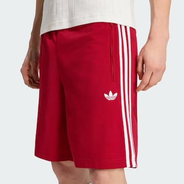 ADIDAS ORIGINALSregular Hlače 'Firebird' - crvena boja
