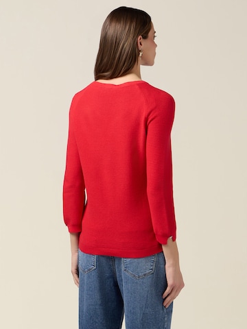 Pullover di oltre in rosso
