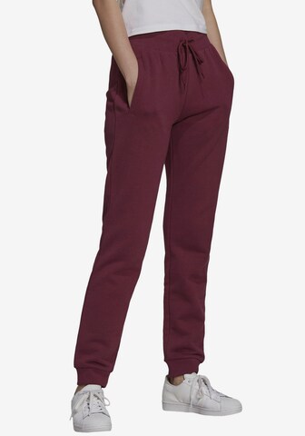 Effilé Pantalon ADIDAS ORIGINALS en rouge