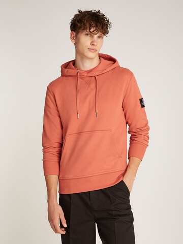 Felpa di Calvin Klein Jeans in arancione: frontale