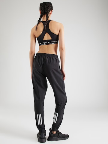 ADIDAS PERFORMANCE Tapered Sporthose 'Own The Run' in Schwarz