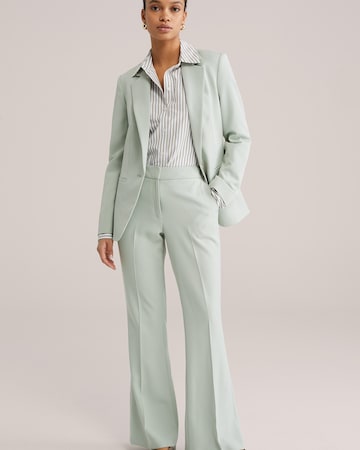 WE Fashion Flared Pressveckad byxa i grön