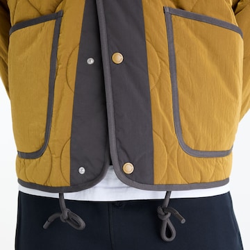 new balance Between-Season Jacket in Yellow