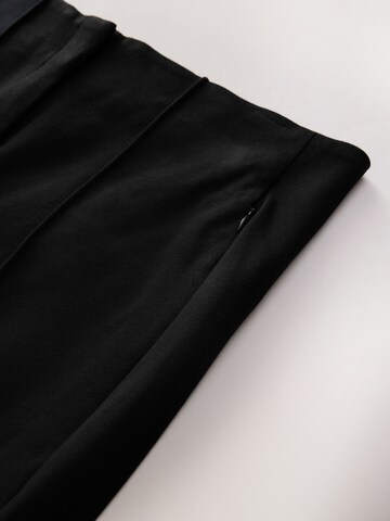 melns Next Paplatināti gali Bikses