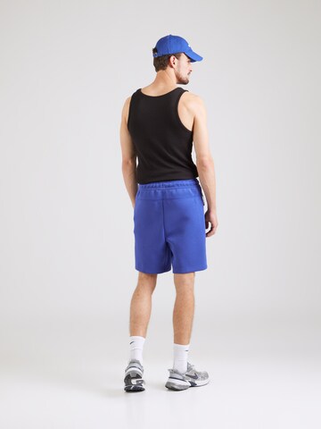 Nike Sportswear Loosefit Bukser 'Tech Fleece' i blå