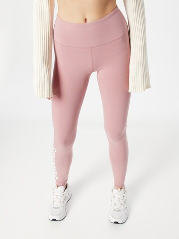 CONVERSE Skinny Kalhoty 'Wordmark' – pink: přední strana