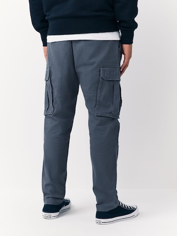 Next Slimfit Gargohousut värissä sininen