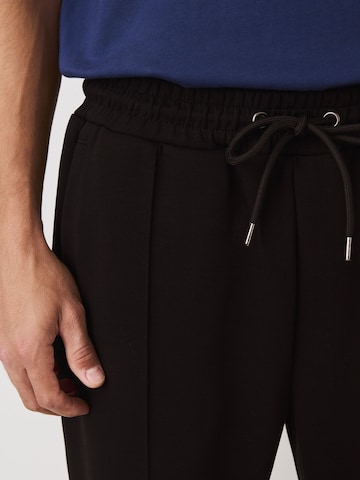 melns Next Standarta Bikses