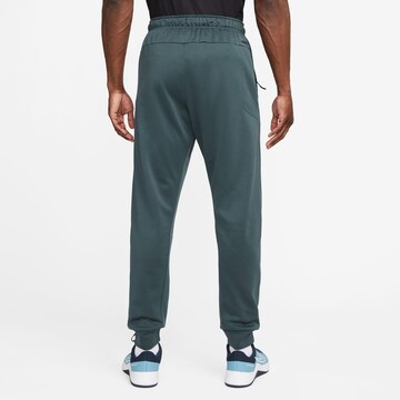 NIKE Tapered Athletic Pants in Green