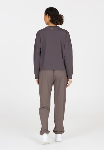 Athlecia Regular Sports trousers in Brown