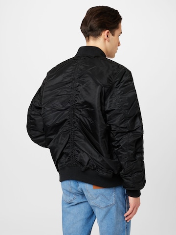 Veste mi-saison ALPHA INDUSTRIES en noir