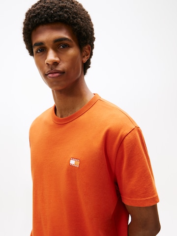 Tricou de la Tommy Jeans pe portocaliu