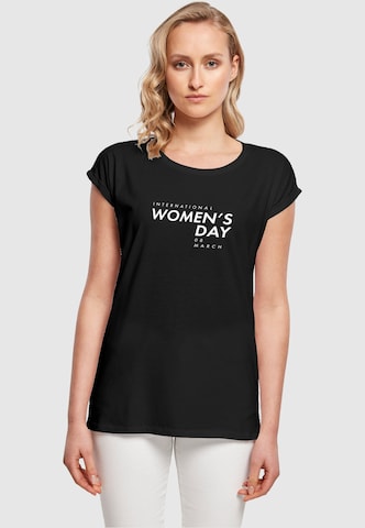 Merchcode Shirt 'WD - International Women's Day' in Zwart: voorkant