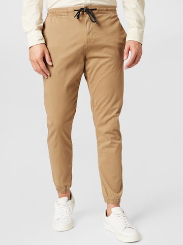 TOM TAILOR DENIM Tapered Pants in Beige: front