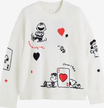 Chinti & Parker Trui 'Autumn Peanuts '25 Charlie Poker Pals' in Beige: voorkant